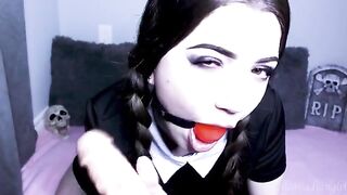 Wednesday Addams gets fucked by a big dildo and gives a blowjob, showcasing her unique charm