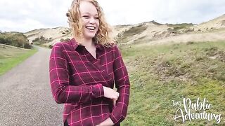 Busty girl enjoys public exposure on the beach with her toy