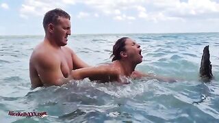 Babe has amazing sex right in the blue lagoon, showcasing sensual passion