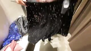 A girl chose a dress in the fitting room and got cum on her tits