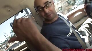 A sexy woman gets a hard cock in her mouth while driving in the car