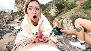Two young and sexy girls are having fun with guys on the beach