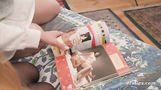 Two hot lesbians have a look at the Kama Sutra and imitate it with their bodies