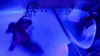 A sexual blondie is playing with sex toys in the bathroom