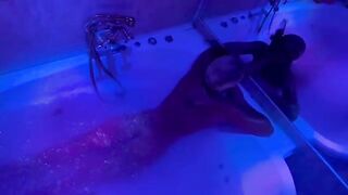 A sexual blondie is playing with sex toys in the bathroom