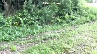 A young French couple enjoys a passionate outdoor encounter in a forest setting