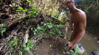 A couple is fucking on the bank of a river in the jungle
