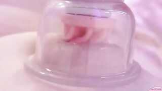 A girl plays with her nipples and wet pussy using a toy, moaning loudly
