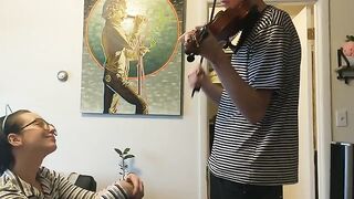 Girl trying to practice violin, but her boyfriend is jerking off instead