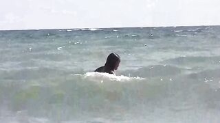 A group of girls sunbathe naked on the beautiful beach