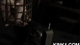 A slave in a cage is at the mercy of his master's orders