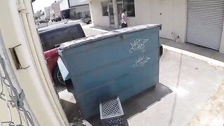 The couple was photographed having sex behind the garbage tank