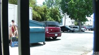 The couple was photographed having sex behind the garbage tank
