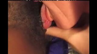A young black girl is having fun with an older white guy