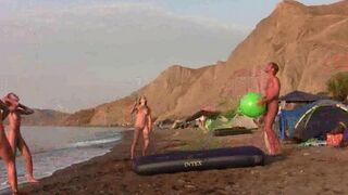 A game of badminton with a naked beauty on the beach