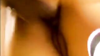 An Asian woman is being fucked by two guys at her home