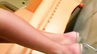 A beauty in a leather chair plays with herself and gets to know herself better