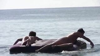 A naked girl is having fun on the beach without any clothes