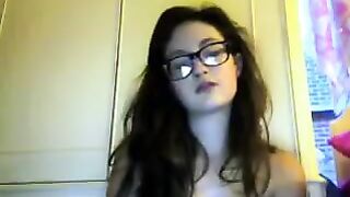 A student with glasses plays and caresses herself on webcam