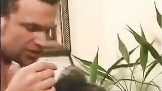 A 40-year-old guy playing a joke on the girl, touching her by the nipples