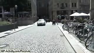 A girl has a walk with an open pussy in public place