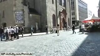 A girl has a walk with an open pussy in public place
