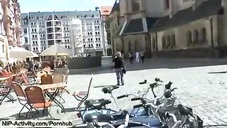 A girl has a walk with an open pussy in public place