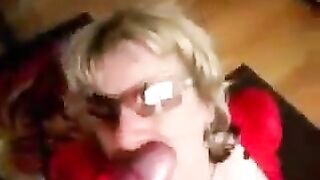 A woman in leather corset sucks cock and cums on her big tits