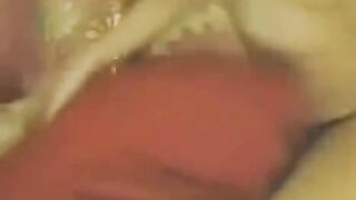 A Chinese girl masturbates in front of a webcam with glasses on