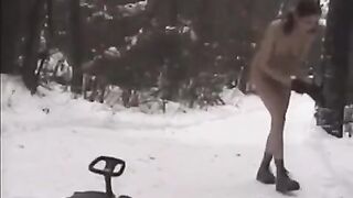 Nude girls throw snowballs at each other on the street in winter