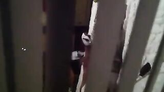 He shoots a hidden camera as his neighbors have sex, just like in the movies