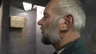 A young girl is being fucked by three guys in a prison setting