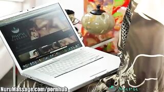 An Asian massage master uses oil to caress her client’s tits