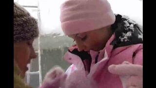 Two girls are having fun on a cold winter day in this hot video