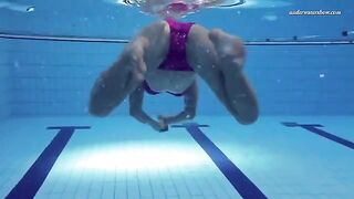 Naked beauty has a quiet moment in the pool