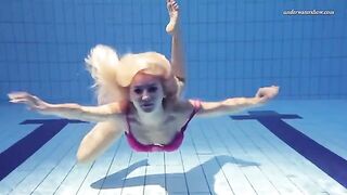 Naked beauty has a quiet moment in the pool