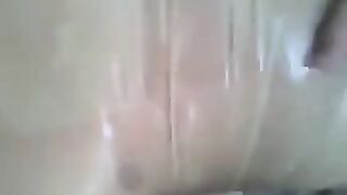 A guy put a condom on his dick and masturbated it