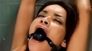 A bald man fucked a girl with the help of a sex machine