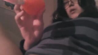 A girl has a little fun with her vibrator on the bed