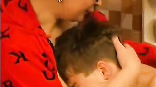 A hot woman in glasses is fucking with a guy and gets cum on her face