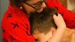 A hot woman in glasses is fucking with a guy and gets cum on her face