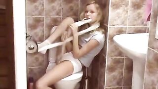 A hot young blonde has a surprising encounter in the public toilet