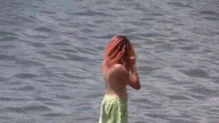 A group of nudists enjoy their time in a beautiful region