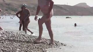 A group of nudists enjoy their time in a beautiful region