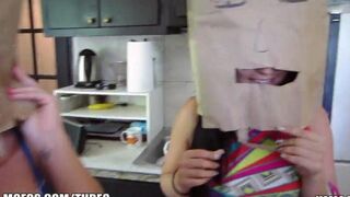 Two girls share the same bag on their heads during sex