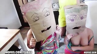 Two girls share the same bag on their heads during sex
