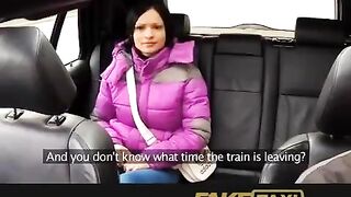 A hot girl is having fun with a taxi driver in his car