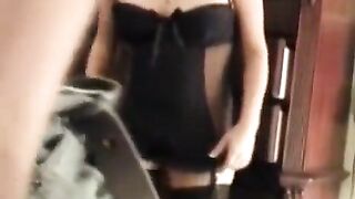 A husband shoots his wife in corset porn, showcasing her stunning figure