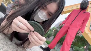A hot Chinese girl participates in a twisted version of the Squid Game, competing for sex