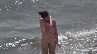 Nudist couple enjoys romantic sex on the beach